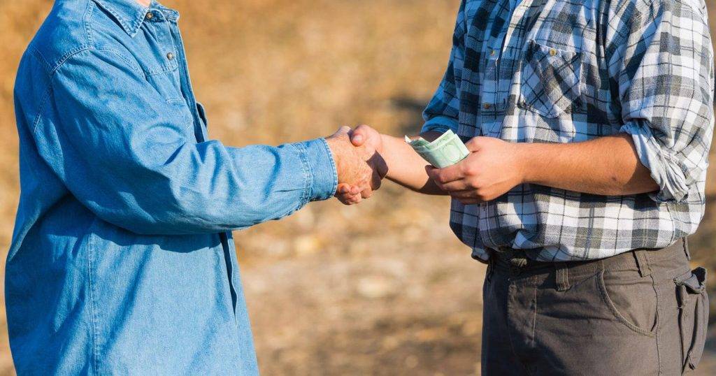 Farmer handshake/ business deal.